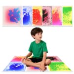 Child stepping on a liquid sensory floor tile, creating moving colors for calming sensory play.