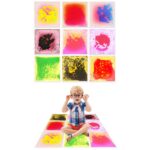 Preschool classroom sensory area with kids using liquid floor tiles