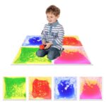 Child stepping on sensory liquid floor tiles in a home playroom