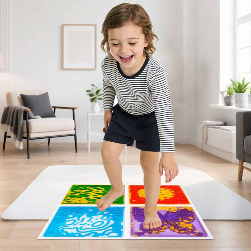 Child walking on colorful interlocking liquid sensory squares at home